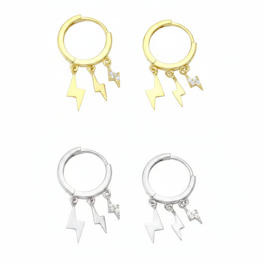 Two pairs of earrings, one with gold plating and the other with silver plating, each featuring a small loop with three dangling charms in the shape of thunders, set with cubic zirconia.