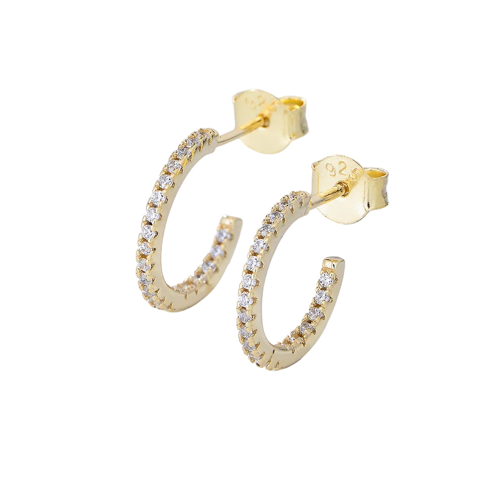 A pair of gold hoop earrings with small clear stones set along the front, shown on a clean white background. One earring is facing forward to show the post and backing, while the other is angled to show the side.